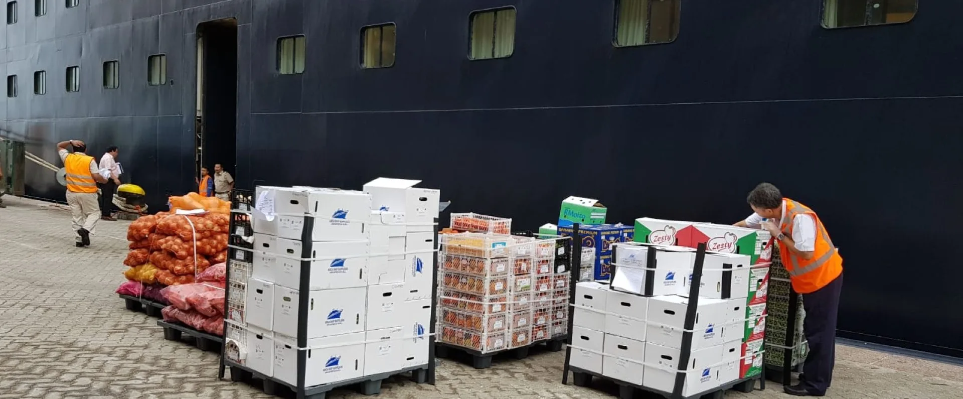 Marine provisions and supplies being coordinated alongside a vessel